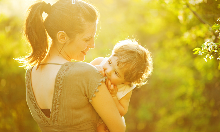 Mother and young child in the sun